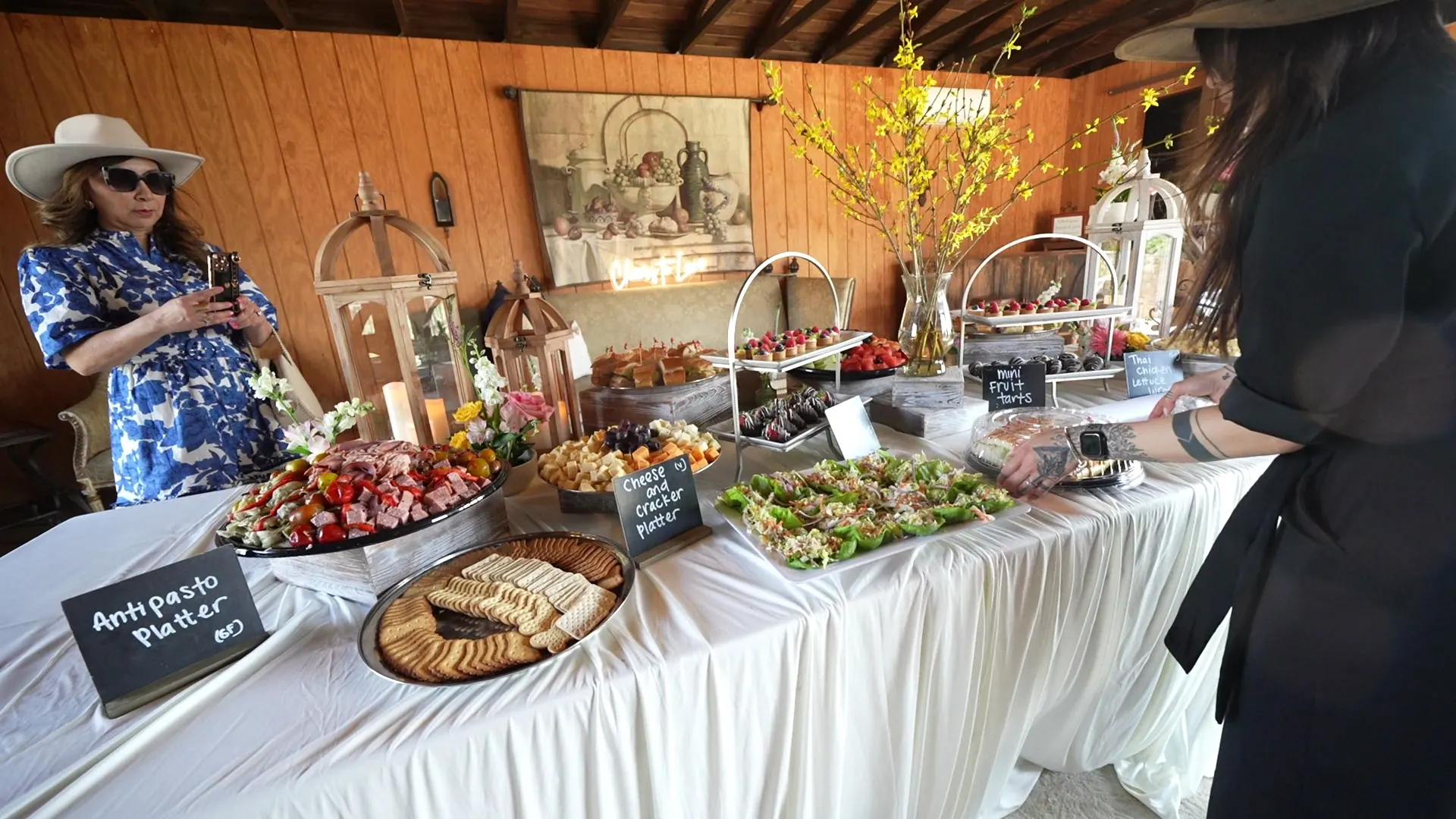 Antipasto and grazing table with chalkboard signs at an Albany indoor event