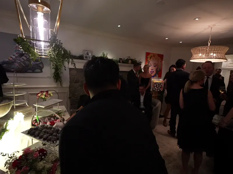 Dessert tier station set near the fireplace at an Albany house party