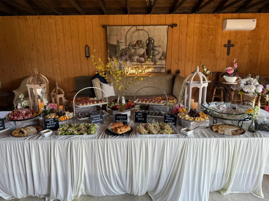 Grazing table of cured meats, cheeses, fruit, olives and crostini styled for an Oakland cocktail reception by Oakland Catering Company