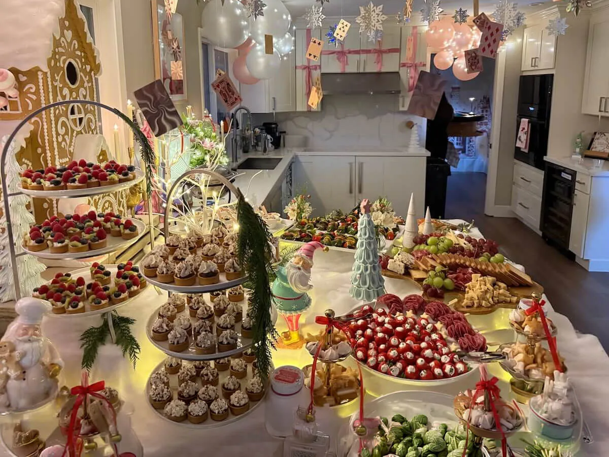Themed tablescape layering tiered tarts, cupcakes and charcuterie under pastel balloon decor — styled party tablescapes for Oakland and El Cerrito celebrations